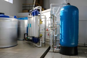 Portable water treatment system reducing plastic waste at remote site